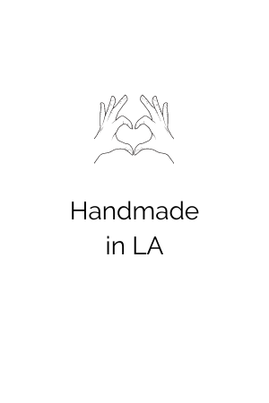 Handmade in LA with line drawing of hands making a heart