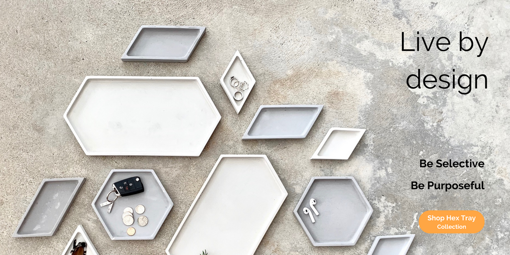 Live by design, be selective, be purposeful, shop hex tray collection, flay lay view of geometric concrete trays