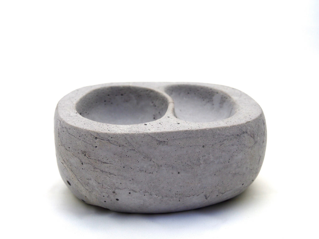 The Stephanie bowl, small grey concrete, two nestled indentations, side view