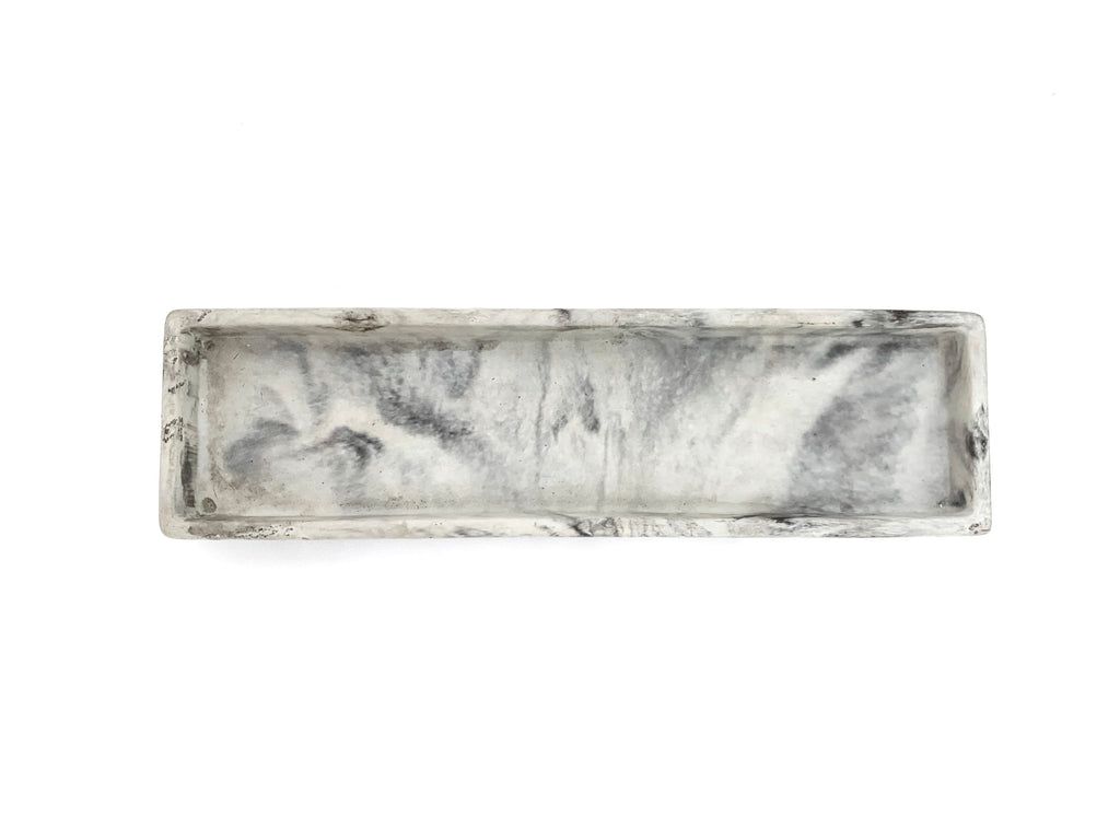 Concrete pen tray marbled top view, modern home decor